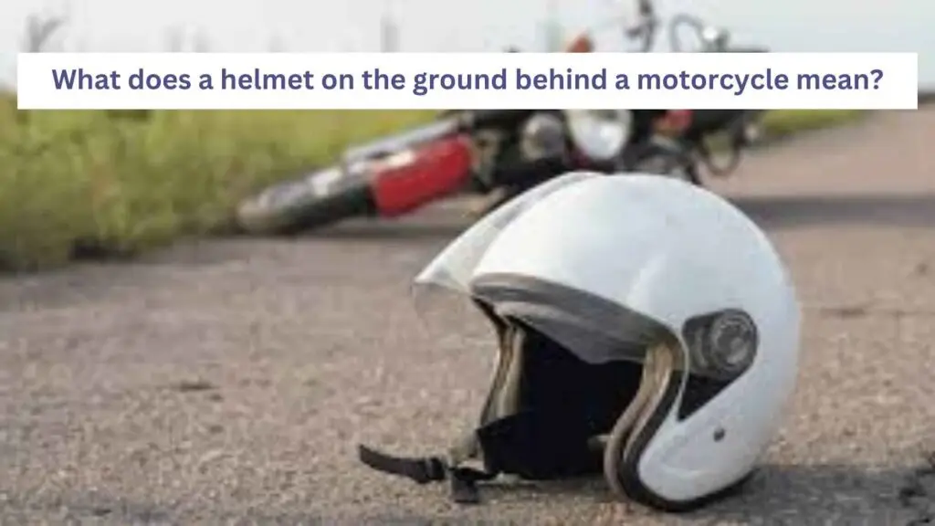 helmet on the ground behind a motorcycle